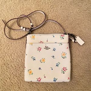 White floral Coach crossbody bag